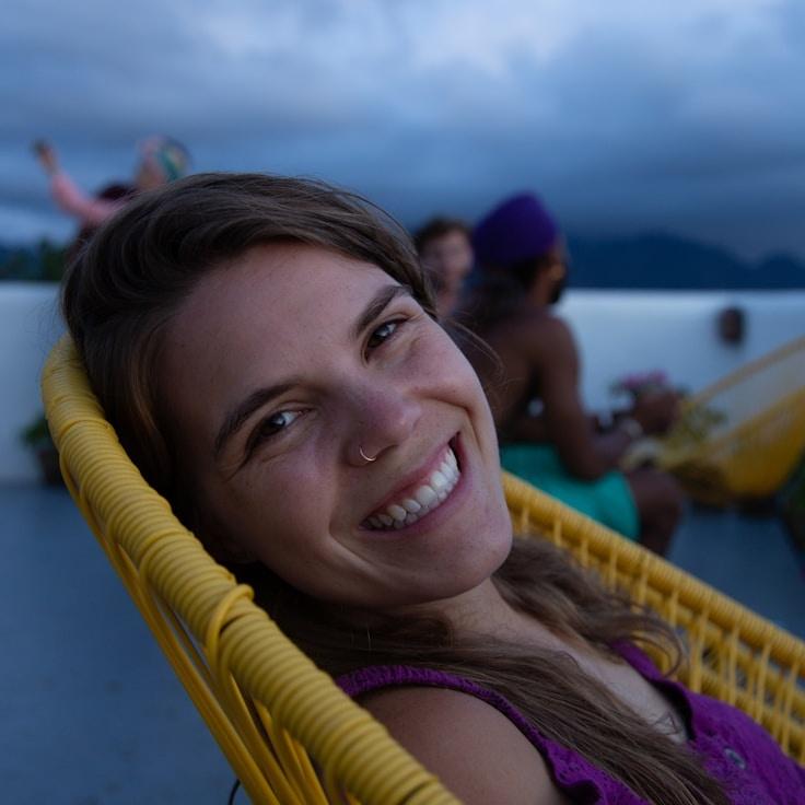 Avery Singh, Lead Design Curator at Canvas Route Hub, reviewing corporate floral arrangements